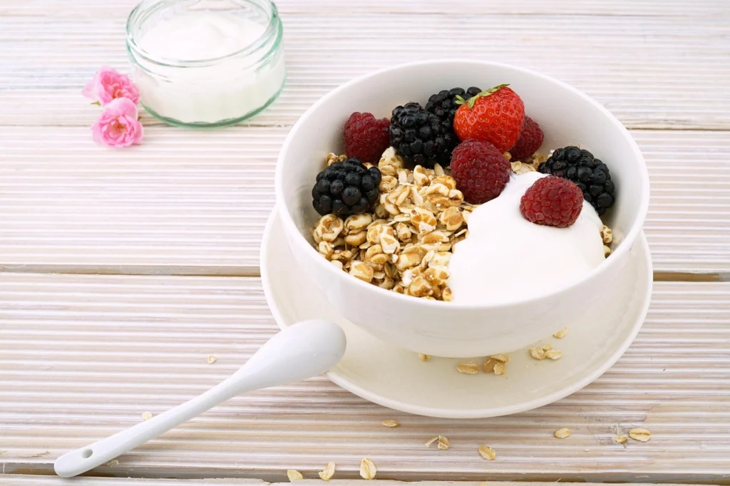 Skyr in a bowl topped with fresh berries and granola