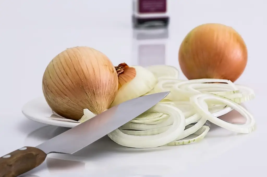 Chopping vegetables for meal prep on a cutting board